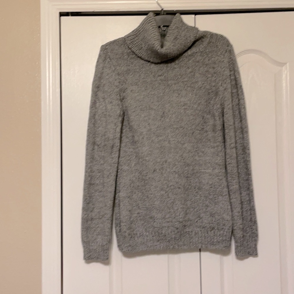 Grey turtleneck sweater.